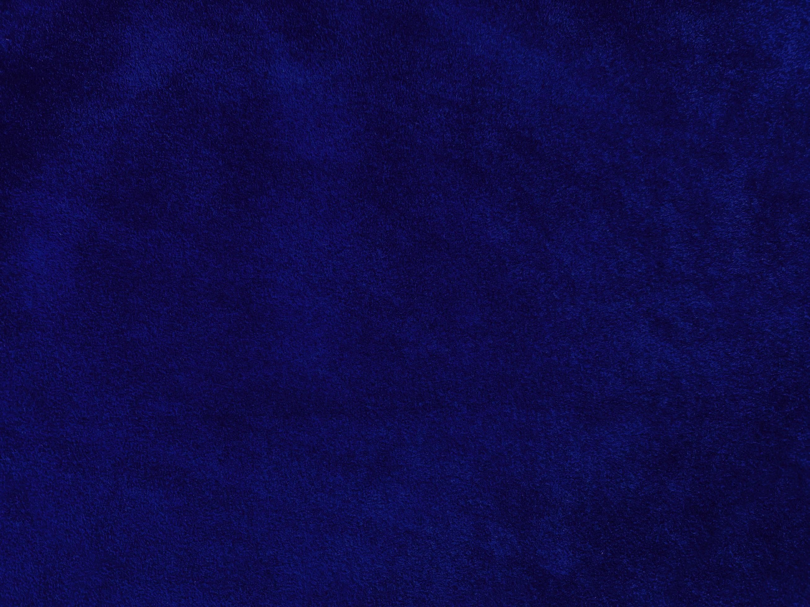 Blue velvet fabric texture used as background. Empty blue fabric ...