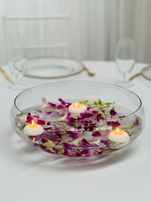 Glass bowl with singapore orchids and floating candles - Weddings of ...